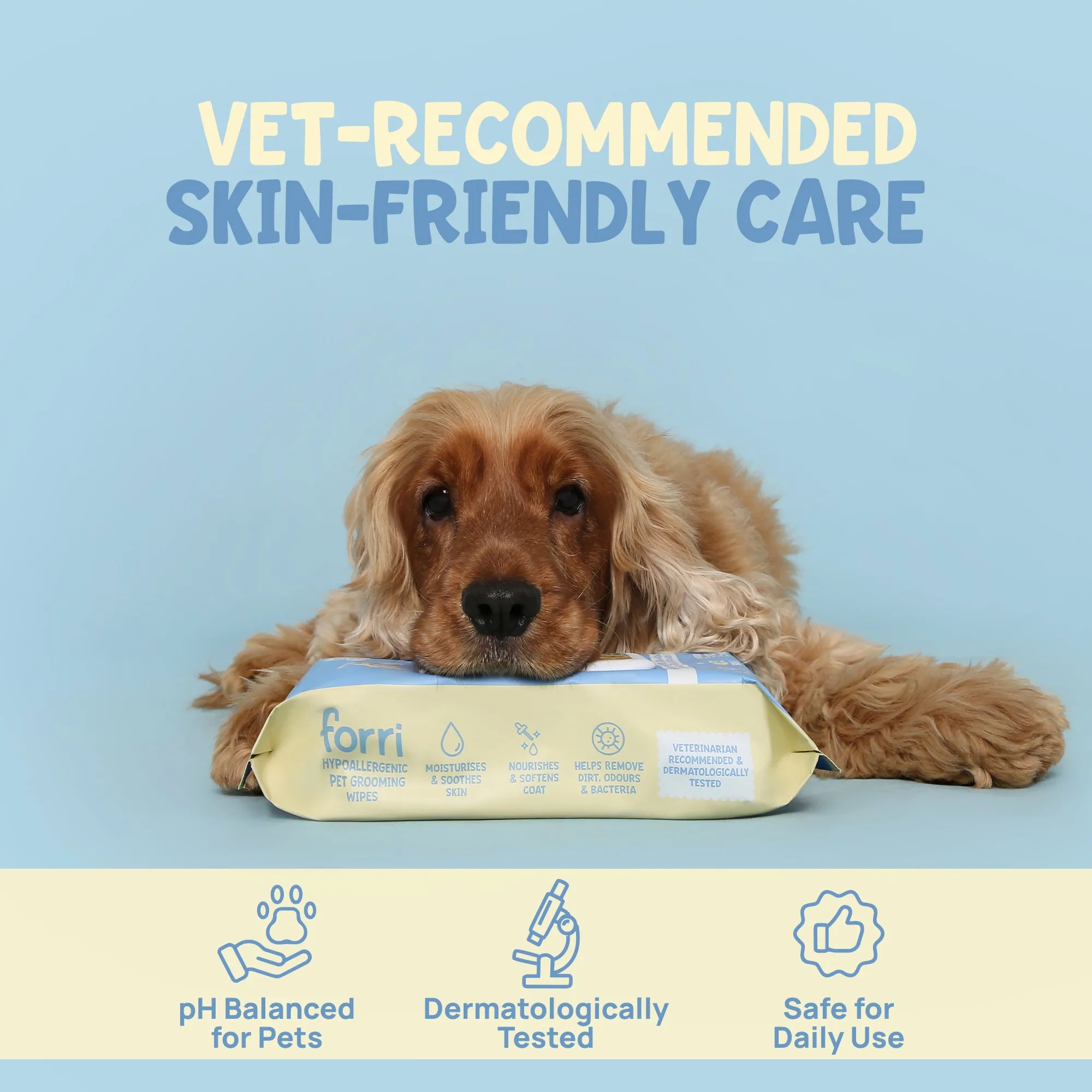 Dog lying behind a package of forri wipes with text about veterinarian-recommended skin-friendly care on a blue background.